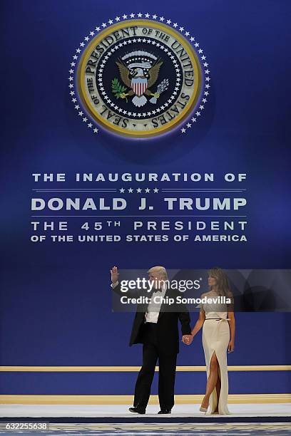 President Donald Trump and first lady Melania Trump arrive at the Armed Forces Ball at the National Building Museum January 20, 2017 in Washington,...