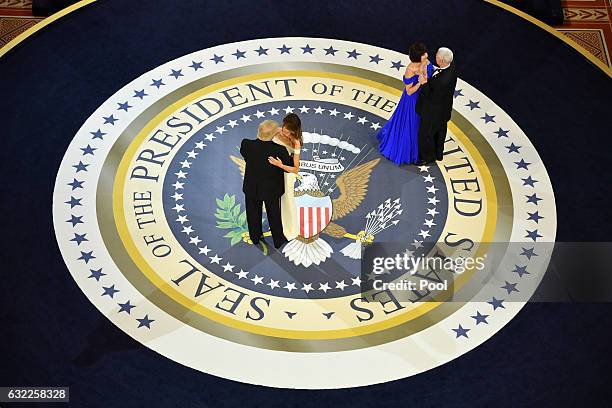 President Donald Trump and First Lady Melania Trump dance with Vice President Mike Pence and Karen Pence at the A Salute to Our Armed Services Ball...