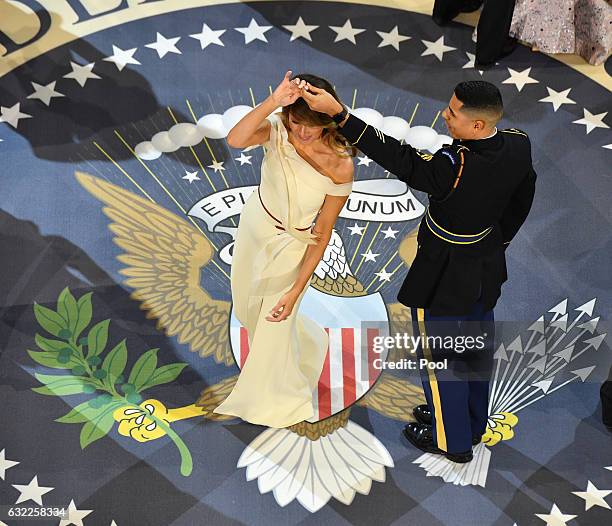 First Lady Melania Trump dances with a Marine at the A Salute to Our Armed Services Ball on January 20, 2017 in Washington, D.C. Trump will attend a...