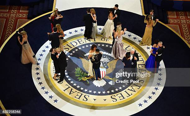 President Donald Trump, First Lady Melania Trump, Vice President Mike Pence and Karen Pence dance with members of the armed services at the A Salute...