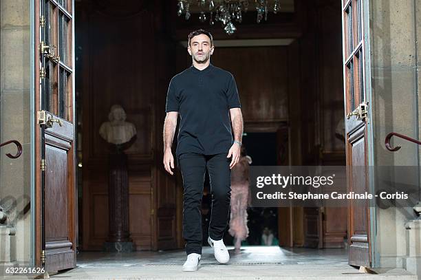 Designer Riccardo Tisci acknowledges the applause of the audience after the Givenchy Menswear Fall/Winter 2017-2018 show as part of Paris Fashion...