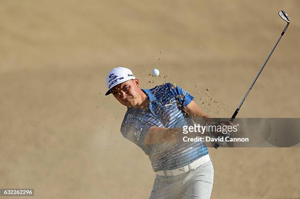 Rickie fowler of the United States plays his third shot on the first hole during the third round of the 2017 Abu Dhabi HSBC Golf Championship at Abu...