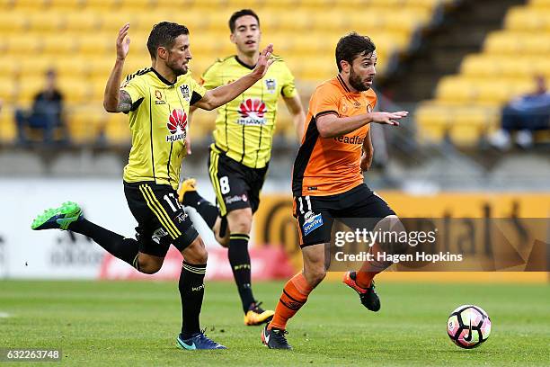 Tommy Oar of the Roar beats the defence of Vince Lia of the Phoenix during the round 16 A-League match between the Wellington Phoenix and the...