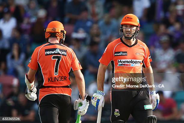 Michael Klinger and Shaun Marsh of the Scorchers talk between overs during the Big Bash League match between the Hobart Hurricanes and the Perth...