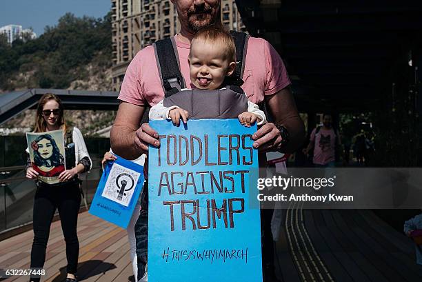 Protesters take part in the Women's March rally on January 21, 2017 in Macau, Macau. The Women's March originated in Washington DC but soon spread to...