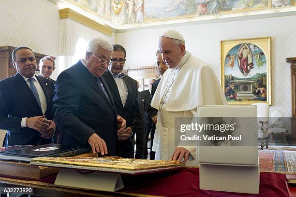 Pope Francis exchanges gifts with Palestinian President Mahmoud Abbas Abu Mazen during an audience at the Apostolic Palace on January 14, 2017 in...