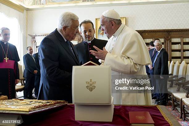 Pope Francis exchanges gifts with Palestinian President Mahmoud Abbas Abu Mazen during an audience at the Apostolic Palace on January 14, 2017 in...