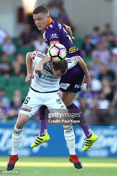 Leigh Broxham of the Victory and Shane Lowry of the Glory contest a header during the round 16 A-League match between Perth Glory and Melbourne...