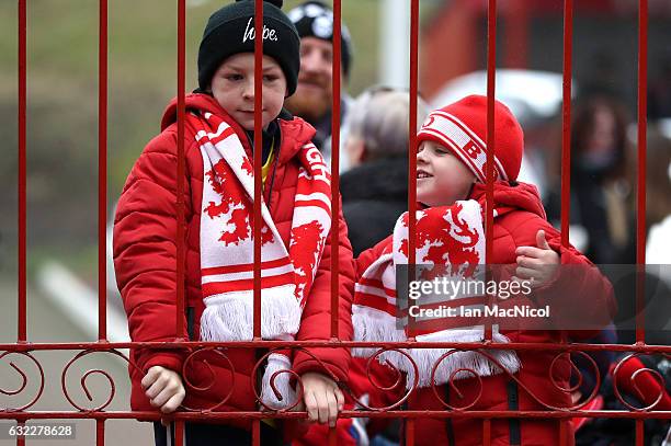 Two Middlesbrough fans wait outside the gates at the stadium prior to the Premier League match between Middlesbrough and West Ham United at the...