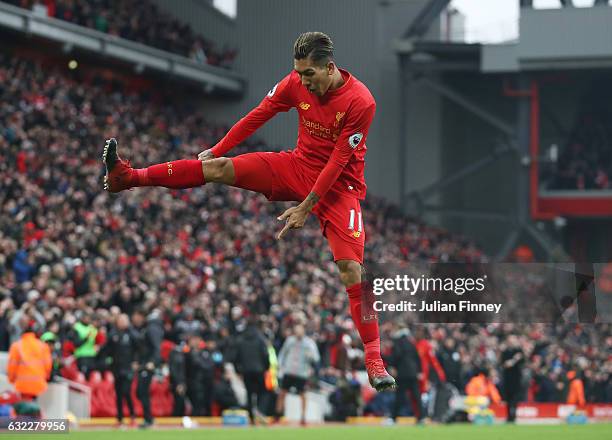 Roberto Firmino of Liverpool celebrates scoring his sides second goal during the Premier League match between Liverpool and Swansea City at Anfield...