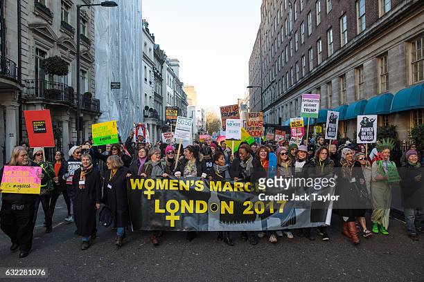 Protesters march from The US Embassy in Grosvenor Square towards Trafalgar Square during the Women's March on January 21, 2017 in London, England....