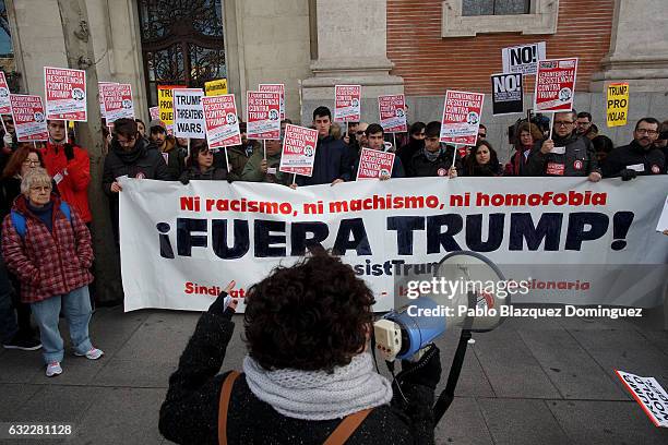 Demonstrators hold a banner reading 'Nor racism, nor maleness, neither homophobic. Trump out!' during a demonstration in front of the US Embassy on...