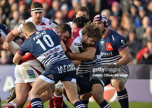 Belfast , Ireland - 21 January 2017; Iain Henderson of Ulster supported by Andrew Warwick being tackled by Ian Madigan of Bordeaux-Begles during the...