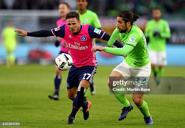 Ricardo Rodriguez of Wolfsburg and Nicolai Mueller of Hamburg battle for the ball during the Bundesliga match between VfL Wolfsburg and Hamburger SV...