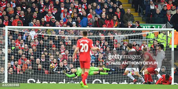 Swansea City's Spanish striker Fernando Llorente scores their second goal during the English Premier League football match between Liverpool and...