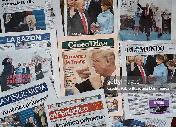 An arrangement of Spanish newspapers show U.S. President Donald Trump on the front pages the day after his inauguration on January 21, 2017 in...