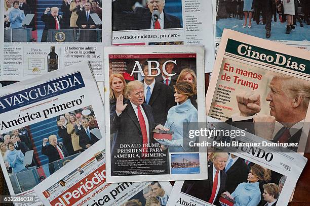 An arrangement of Spanish newspapers show U.S. President Donald Trump on the front pages the day after his inauguration on January 21, 2017 in...