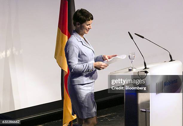 Frauke Petry, co-chairman of the Alternative for Germany party , holds her papers ahead of speaking during a Europe of Nations and Freedom meeting in...