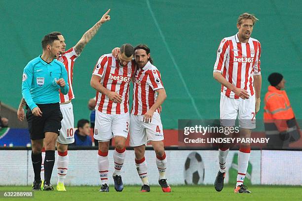 Stoke City's Austrian striker Marko Arnautovic, Stoke City's Dutch defender Erik Pieters, Stoke City's Welsh midfielder Joe Allen and Stoke City's...