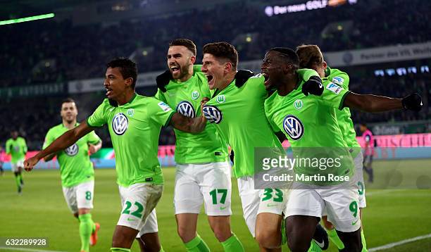 Mario Gomez of Wolfsburg celebrate with his team mates after scoring the opening goal during the Bundesliga match between VfL Wolfsburg and Hamburger...