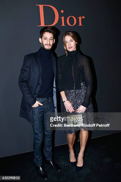 Pierre Niney and Natasha Andrews attend the Dior Homme Menswear Fall/Winter 2017-2018 show as part of Paris Fashion Week on January 21, 2017 in...