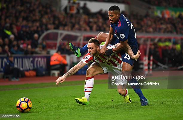 Marko Arnautovic of Stoke City and Antonio Valencia of Manchester United battle for possession during the Premier League match between Stoke City and...