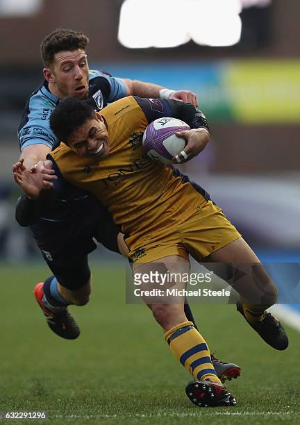 David Lemi of Bristol is tackled by Alex Cuthbert of Cardiff during the European Rugby Challenge Cup Pool 4 match between Cardiff Blues and Bristol...