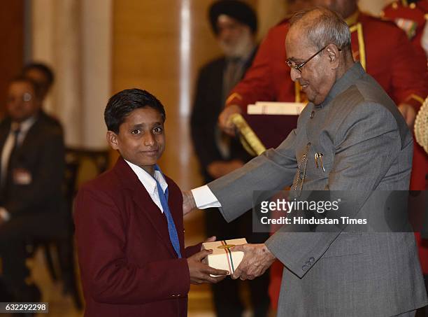 President Pranab Mukherjee presenting the National Awards for Bravery to Sumit Mamgain at Rastrapati Bhawan, on January 21, 2017 in New Delhi, India....