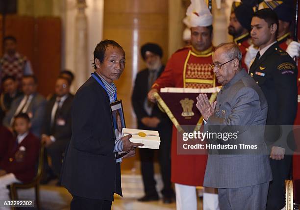President Pranab Mukherjee presenting the National Awards for Bravery to relative of Roluahpuii at Rastrapati Bhawan, on January 21, 2017 in New...