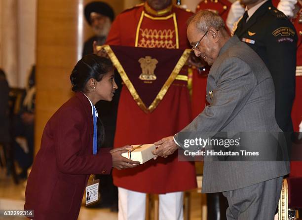 President Pranab Mukherjee presenting the National Awards for Bravery to Siya Vamansa Khode at Rastrapati Bhawan, on January 21, 2017 in New Delhi,...