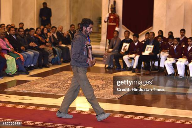 President Pranab Mukherjee presents the National Awards for Bravery to relative of Payal Devi at Rastrapati Bhawan, on January 21, 2017 in New Delhi,...