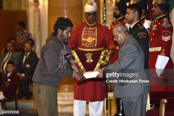President Pranab Mukherjee presenting the National Awards for Bravery to relative of Payal Devi at Rastrapati Bhawan, on January 21, 2017 in New...