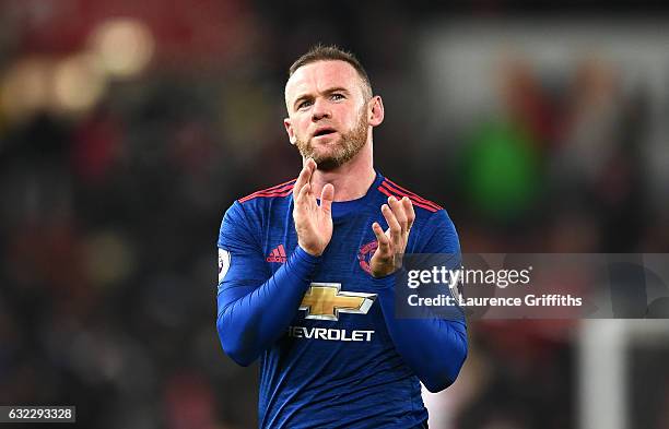 Wayne Rooney of Manchester United shows appreciation to the fans after the Premier League match between Stoke City and Manchester United at Bet365...