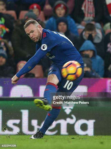 Wayne Rooney of Manchester United scores their first goal and becomes the club's record goalscorer with 250 goals during the Premier League match...