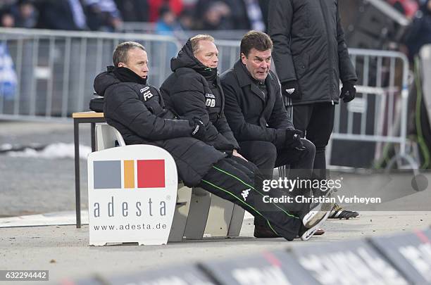 Co-Trainer Frank Geideck, Co-Trainer Dirk Bremser and Head Coach Dieter Hecking of Borussia Moenchengladbach during the Bundesliga Match between SV...