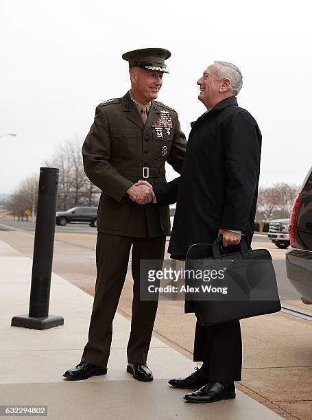 Secretary of Defense James Mattis is greeted by Chairman of the Joint Chiefs of Staff General Joseph Dunford as he arrives for the first day January...