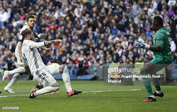 Sergio Ramos of Real Madrid scores his team's second goal past Carlos Kameni of Malaga CF during the La Liga match between Real Madrid and Malaga CF...