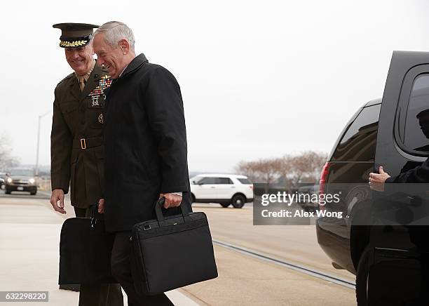 Secretary of Defense James Mattis is greeted by Chairman of the Joint Chiefs of Staff General Joseph Dunford as he arrives for the first day January...