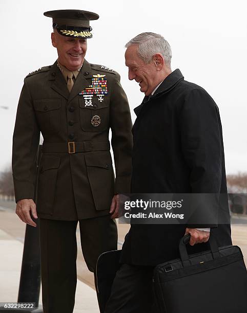 Secretary of Defense James Mattis is greeted by Chairman of the Joint Chiefs of Staff General Joseph Dunford as he arrives for the first day January...