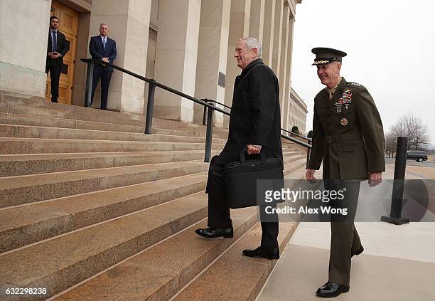 Secretary of Defense James Mattis is greeted and escorted by Chairman of the Joint Chiefs of Staff General Joseph Dunford as he arrives for the first...