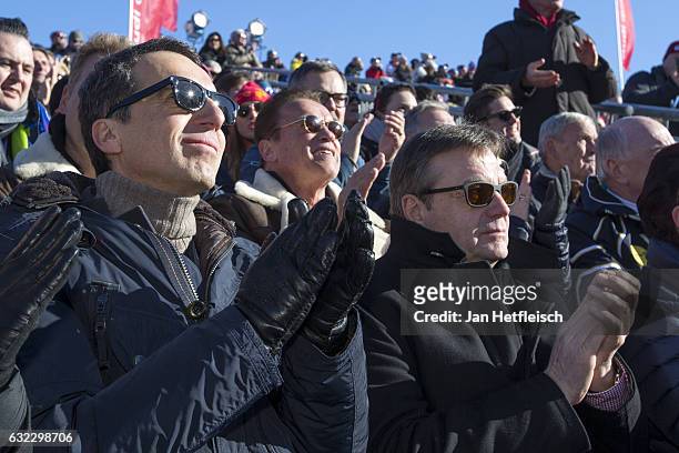 Chancellor of Austria Christian Kern, Arnold Schwarzenegger and the mayor of Tyrol Guenther Platter are seen during the downhill race in Kitzbuehel...