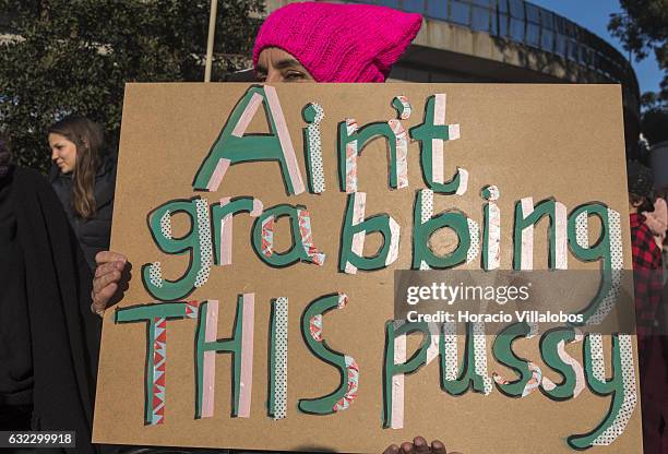 Demonstrators gather to protest against US President Donald Trump in front of the US Embassy on January 21, 2017 in Lisbon, Portugal. Simultaneous...