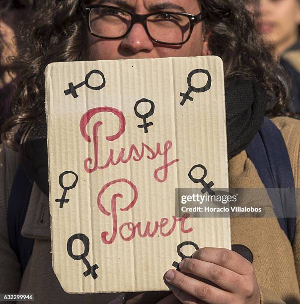 Demonstrators gather to protest against US President Donald Trump in front of the US Embassy on January 21, 2017 in Lisbon, Portugal. Simultaneous...