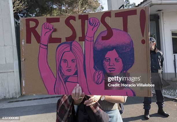 Demonstrators gather to protest against US President Donald Trump in front of the US Embassy on January 21, 2017 in Lisbon, Portugal. Simultaneous...