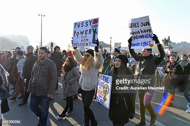 Protestors hold anti-Trump signs as over 2000 people protest during the Women's march in front of Trocadero on January 21, 2017 in Paris, France. The...