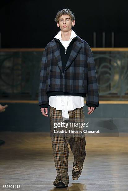 Model walks the runway during the Wooyoungmi Menswear Fall/Winter 2017-2018 show as part of Paris Fashion Week on January 21, 2017 in Paris, France.