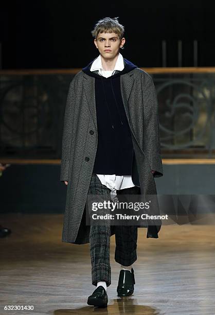 Model walks the runway during the Wooyoungmi Menswear Fall/Winter 2017-2018 show as part of Paris Fashion Week on January 21, 2017 in Paris, France.