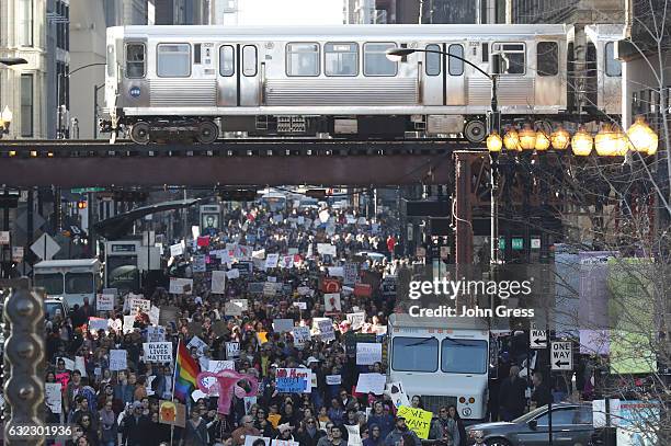 Protesters cheer at the Women's March on January 21, 2017 in Chicago, Illinois. Thousands of demonstrators took to the streets in protest after the...