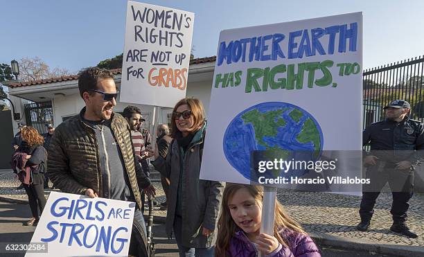 Demonstrators gather to protest against US President Donald Trump in front of the US Embassy on January 21, 2017 in Lisbon, Portugal. Simultaneous...