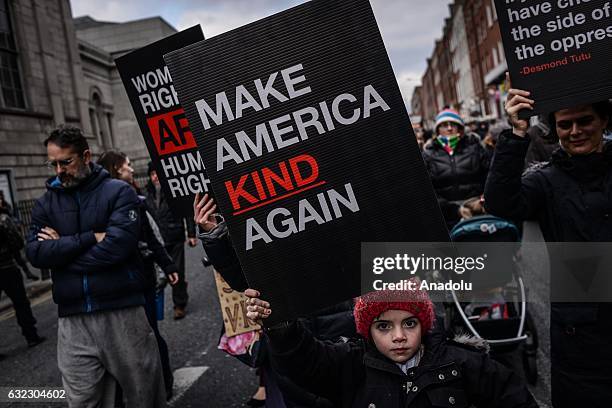 Young boy attends a protest held in solidarity with the Washington DC Women's March in Dublin, Ireland on January 21, 2017.
